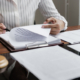 Lawyer reading documents - How do trial lawyers compare to settlement lawyers in personal injury?