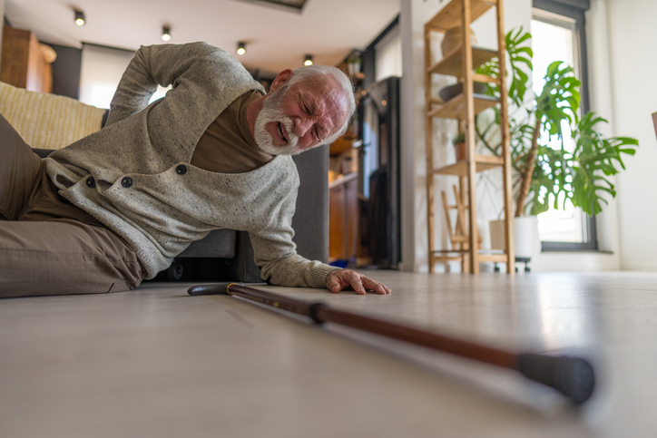 Man on the ground after slipping - Can you sue your apartment complex for a slip and fall?